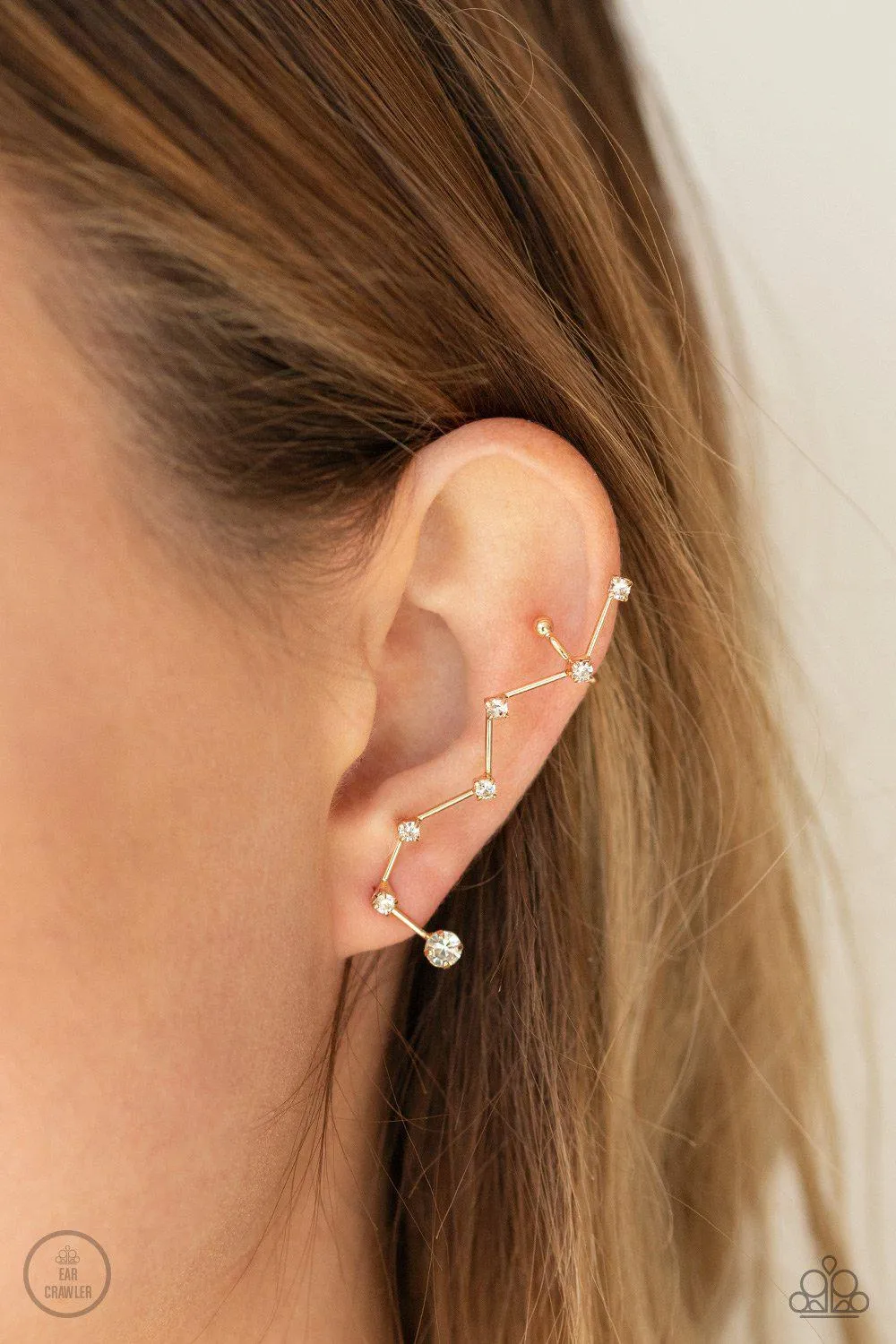 CONSTELLATION Prize Gold and White Rhinestone Ear Crawler Earrings - Paparazzi Accessories